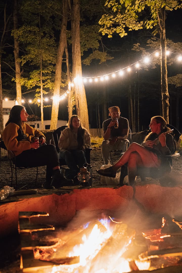 Group gathered around a campfire at Ferncrest