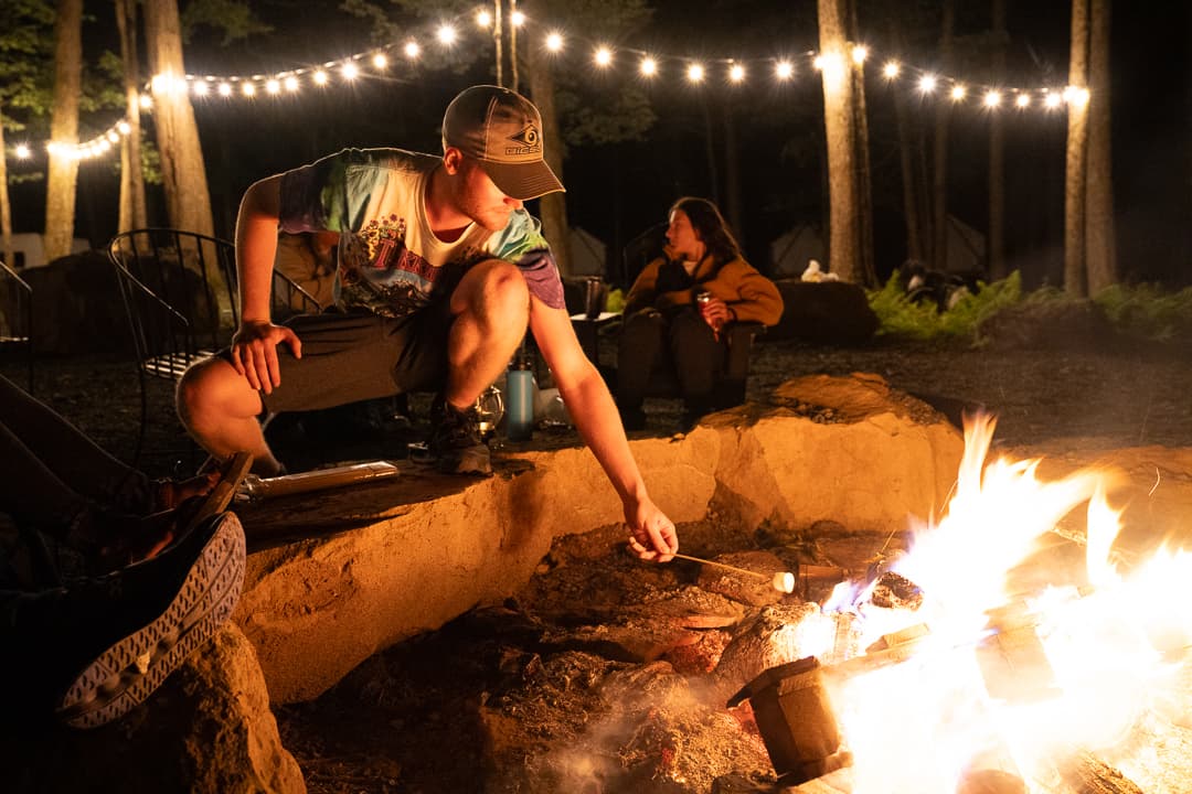 Friends making s'mores around a campfire