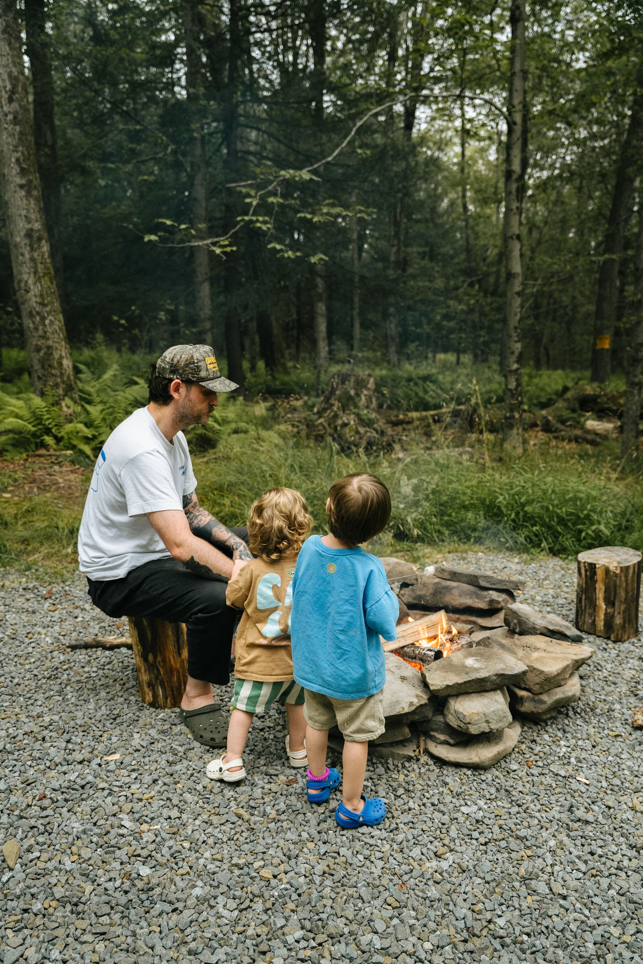 Family gathered around the fire pit at Ferncrest