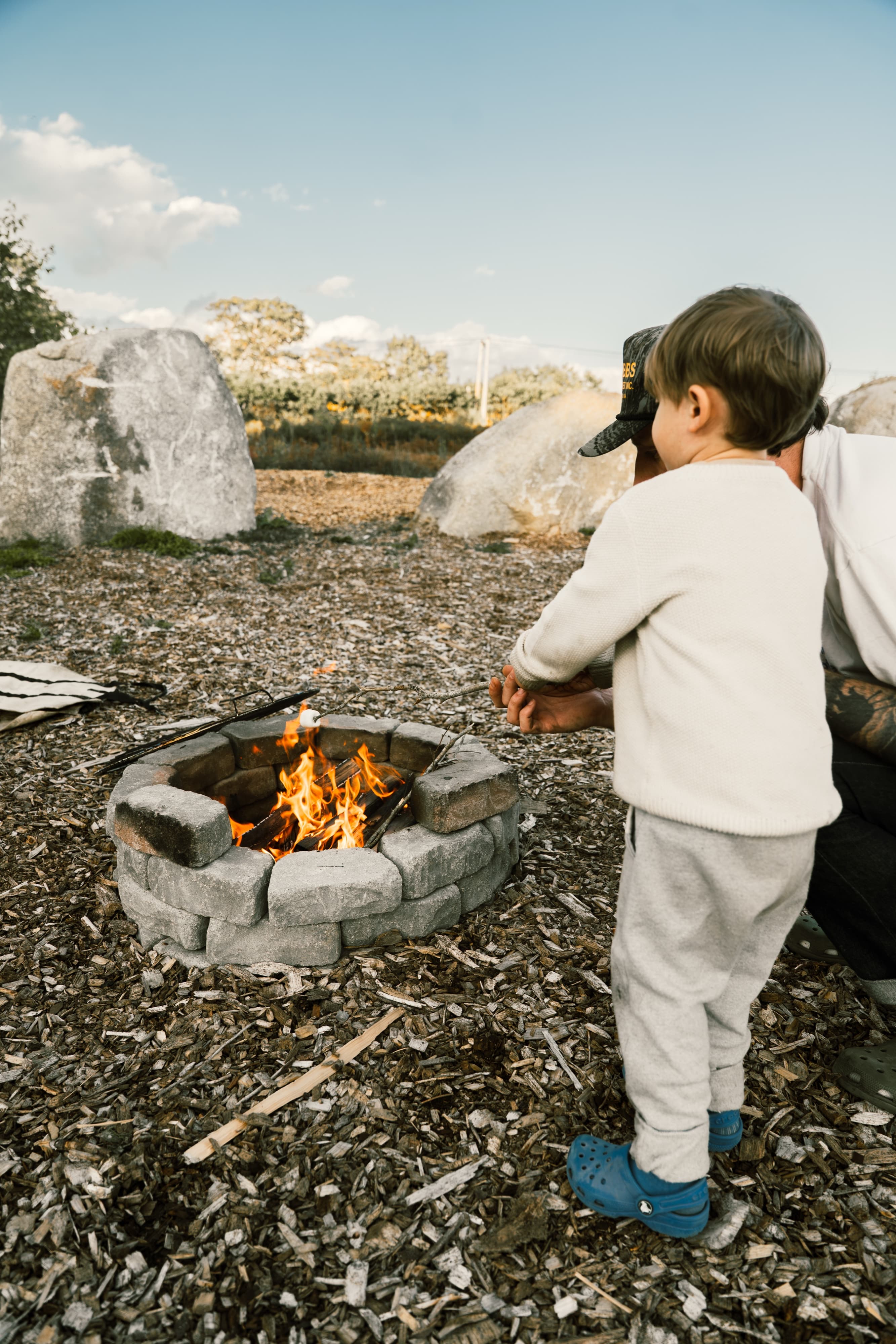 Guests around a fire pit at Ferncrest