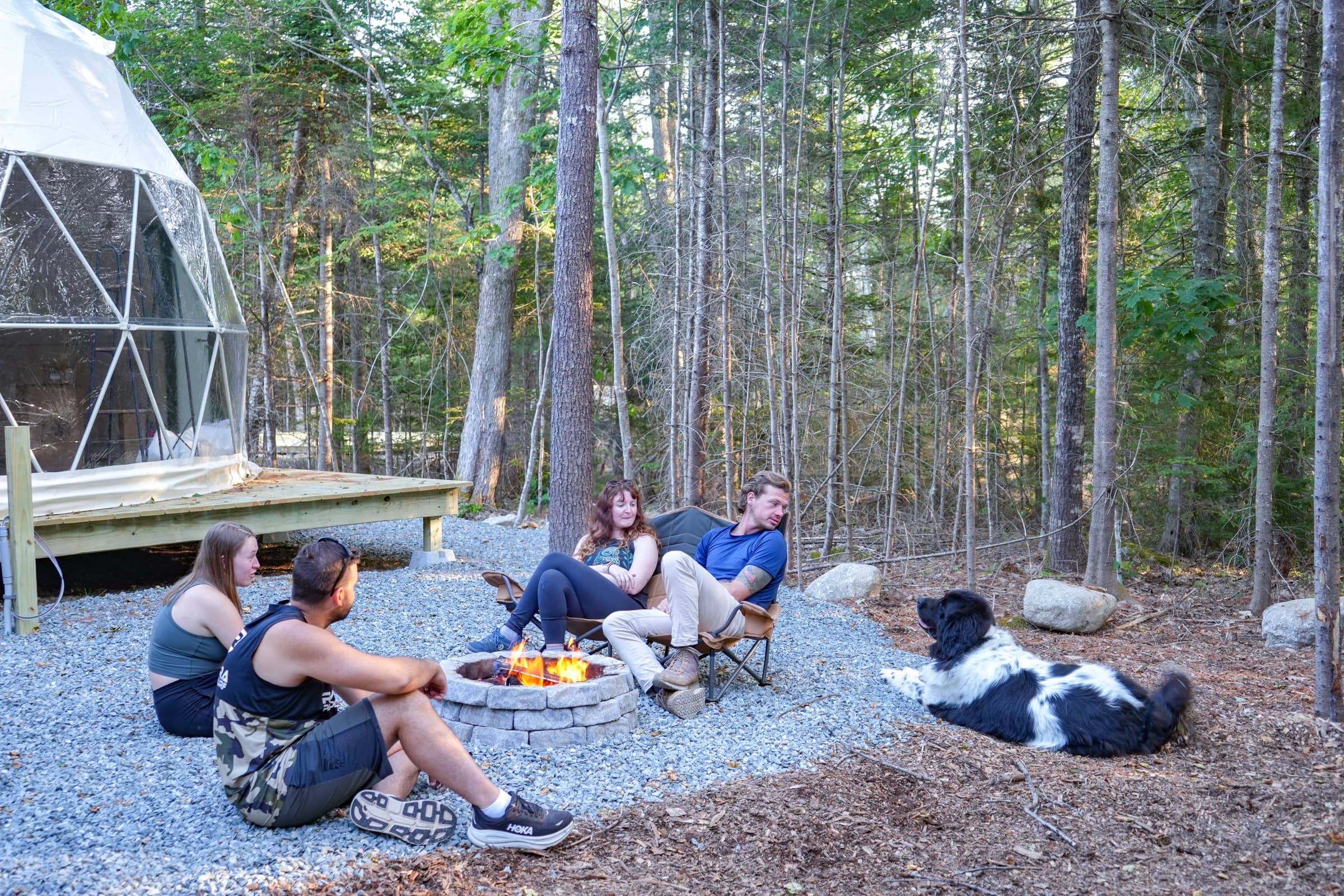 Gathering around the fire at Ferncrest Acadia