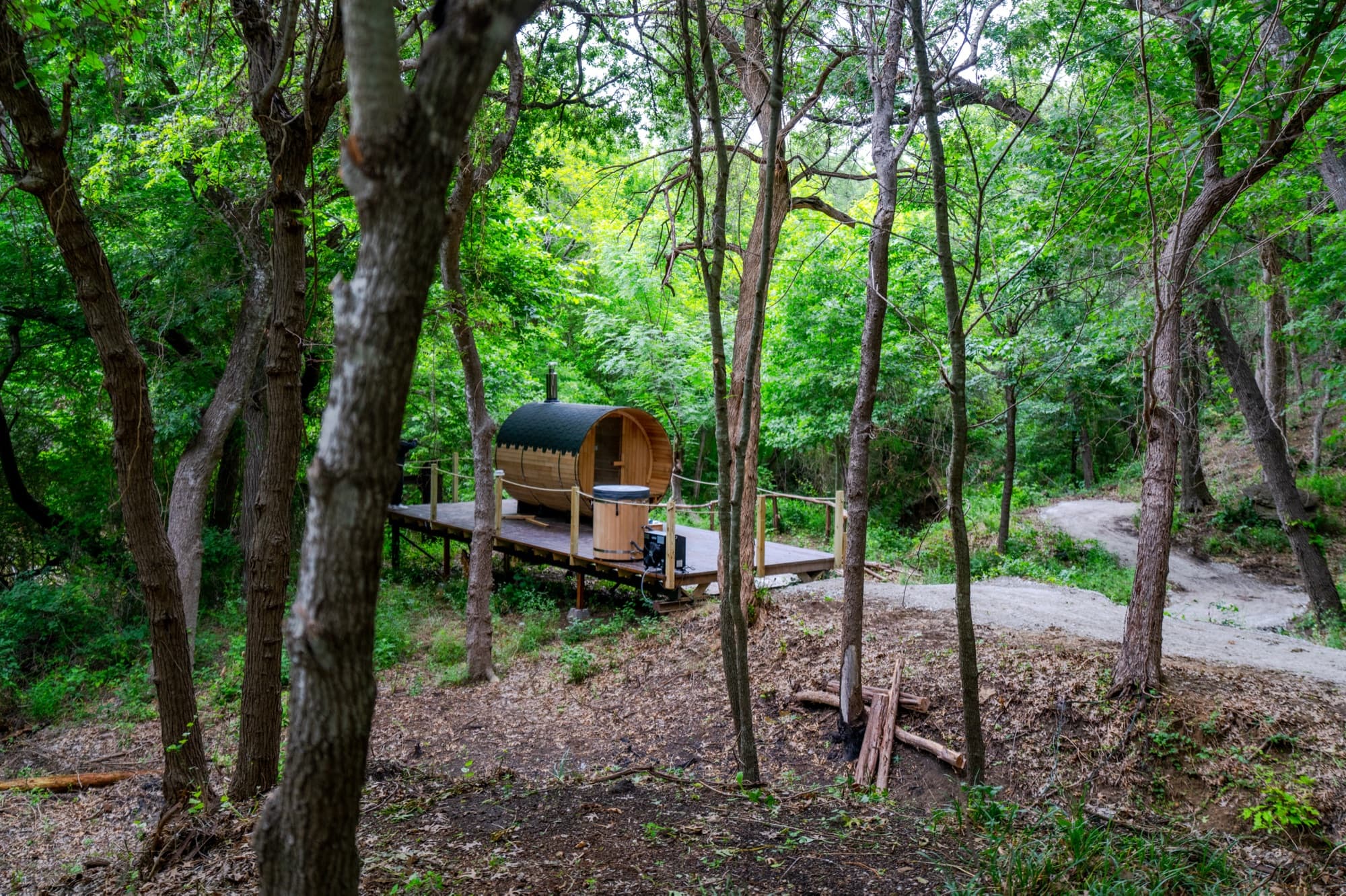 Barrel sauna in the trees at Ferncrest Chambers Creek