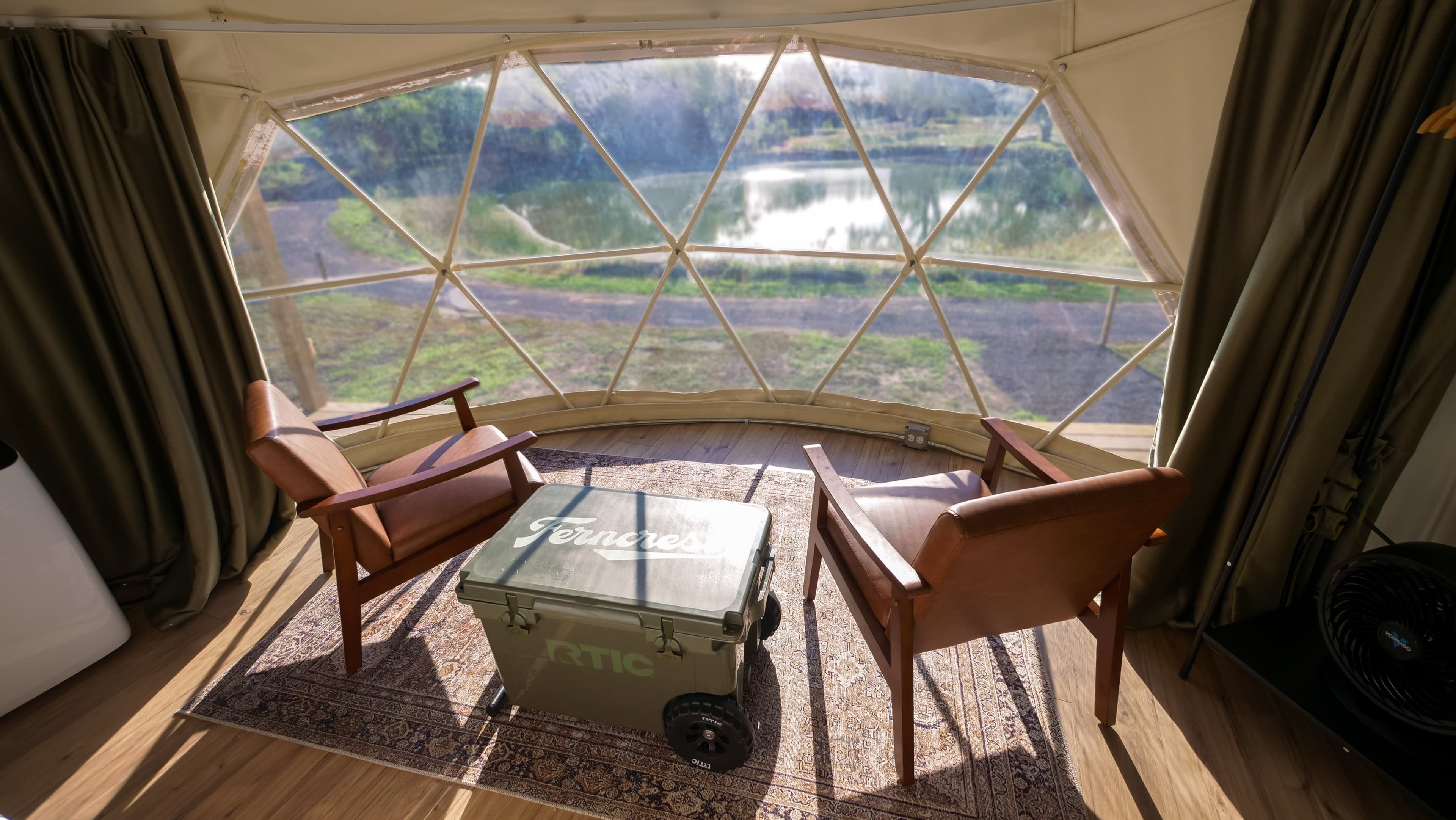 The geodesic window of a Classic Dome looking out over Cottonwood Lake