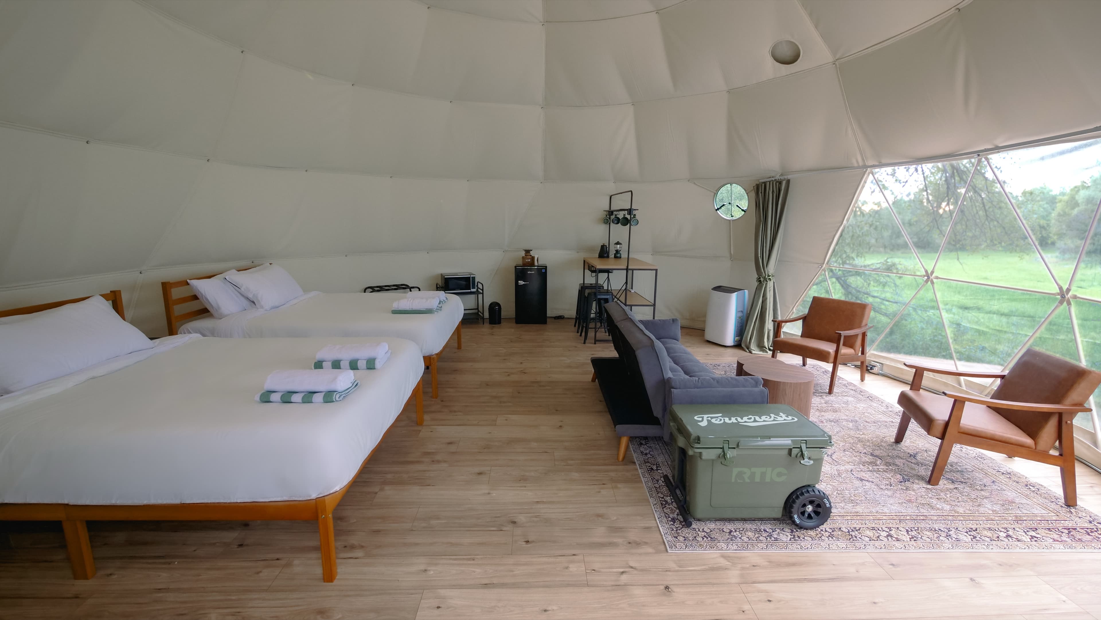 Two queen beds and the Ferncrest cooler inside a Family Dome